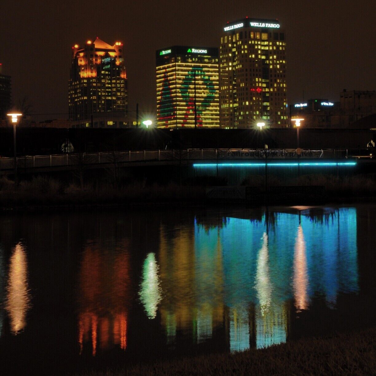 The City of Birmingham, under a management agreement with the Railroad Park Foundation, has created a fabulous public space downtown. I was happy to see it being used heavily even on a cold and cloudy day in December. 
I was impressed by the extent of re-use seen in the walls and seating areas which are constructed from bricks and objects unearthed on the site when Railroad Park construction began. 
This 19 acre green-space was very well thought out and planned. 600 trees are planted with masses of annual, biennial and perennial flowers. The park is 30% water, complete with a beautiful lake and cool rain curtain that is lit at night with LED lights that change color. As you stroll or jog along the parks trails you will see bio-filtrated wetlands and ponds & streams everywhere all irrigated by onsite wells. As the trees start to mature this will only increase the parks awesomeness. 
Well Done Birmingham !
The Park is open 7am-11pm daily. You can visit knowing you are safe as the park is monitored around the clock by a state-of-the-art security system and by rangers on patrol. 
#birmingham
