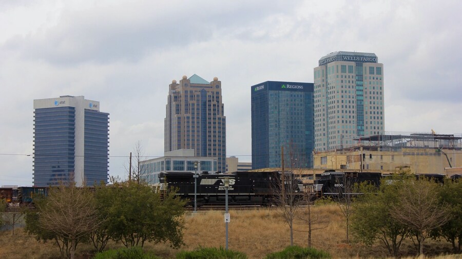 A view of downtown Birmingham with a Norfolk Southern locomotive passing by from Railroad Park. Railroad Park is a 19-acre park in Birmingham, Alabama, that opened in the fall of 2010. The park lies immediately south of the Norfolk Southern and CSX rail lines through downtown Birmingham. It stretches from 14th Street to 18th Street along First Avenue South.