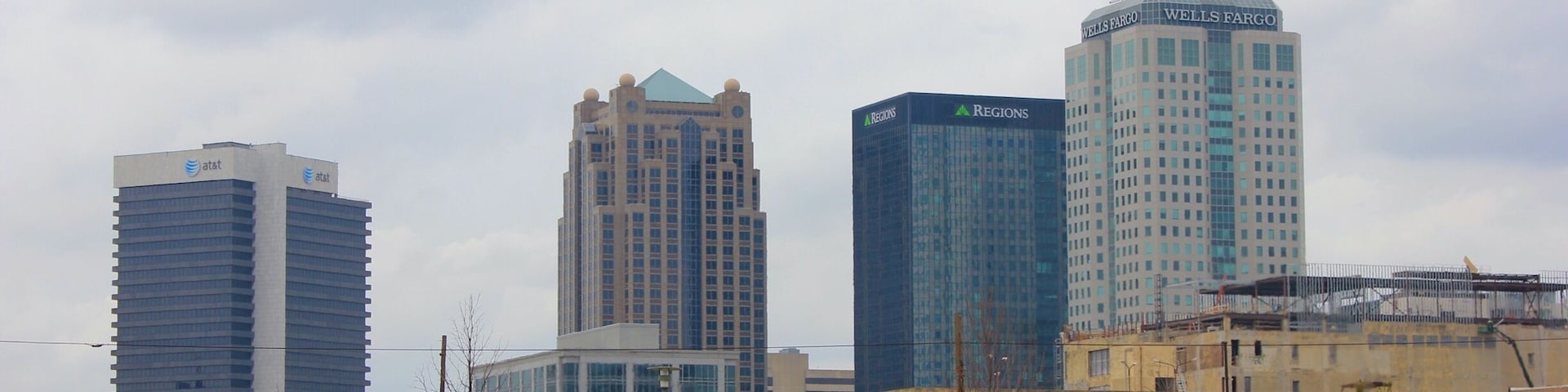 A view of downtown Birmingham with a Norfolk Southern locomotive passing by from Railroad Park.  Railroad Park is a 19-acre park in Birmingham, Alabama, that opened in the fall of 2010. The park lies immediately south of the Norfolk Southern and CSX rail lines through downtown Birmingham. It stretches from 14th Street to 18th Street along First Avenue South.