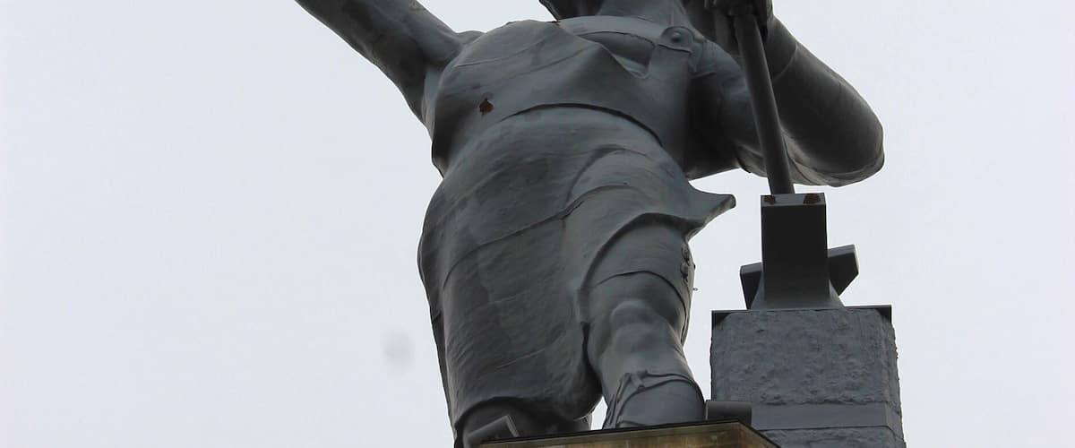 The Vulcan statue is the largest cast iron statue in the world, and is the city symbol of Birmingham, Alabama, reflecting its roots in the iron and steel industry. The 56-foot tall statue depicts the Roman god Vulcan, god of the fire and forge. It was created as Birmingham's entry for the Louisiana Purchase Exposition (1904 World's Fair) in St. Louis, Missouri. The statue is the world's largest iron-ore statue, and among the nation's tallest.