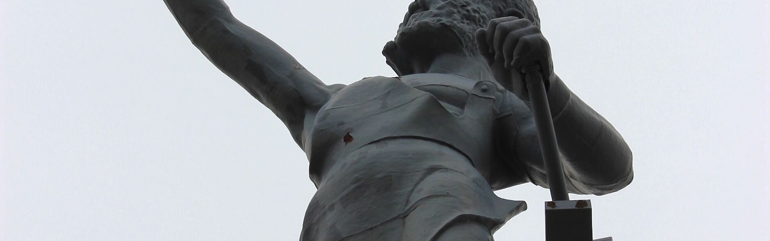 The Vulcan statue is the largest cast iron statue in the world, and is the city symbol of Birmingham, Alabama, reflecting its roots in the iron and steel industry. The 56-foot tall statue depicts the Roman god Vulcan, god of the fire and forge. It was created as Birmingham's entry for the Louisiana Purchase Exposition (1904 World's Fair) in St. Louis, Missouri. The statue is the world's largest iron-ore statue, and among the nation's tallest.