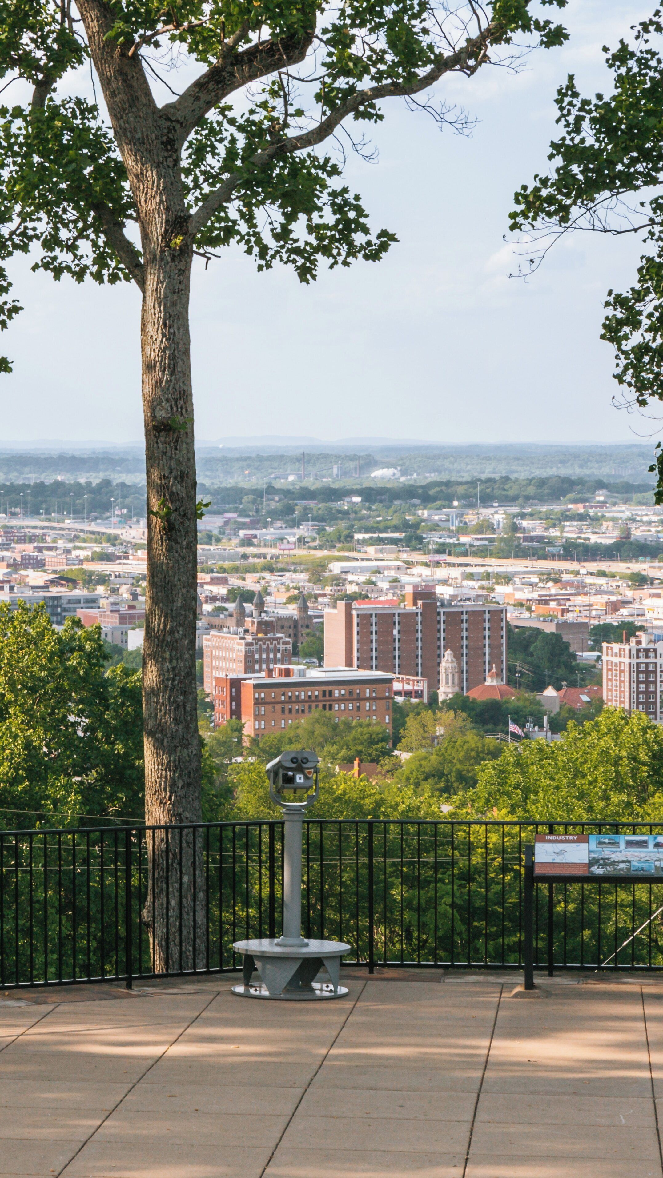 Vulcan Statue overlooks Five Points South in Birmingham, Alabama, showcasing the city's skyline and vibrant atmosphere from a scenic viewpoint