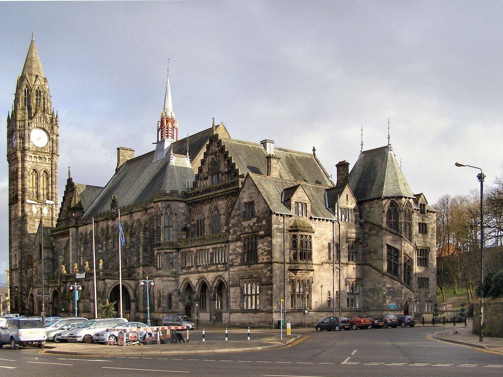 A historic building with a clock tower and a steeple.
