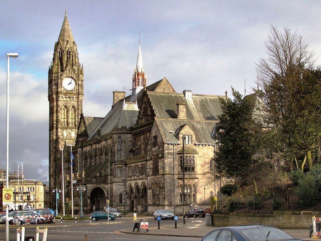 A historic building with a clock tower and a steeple.