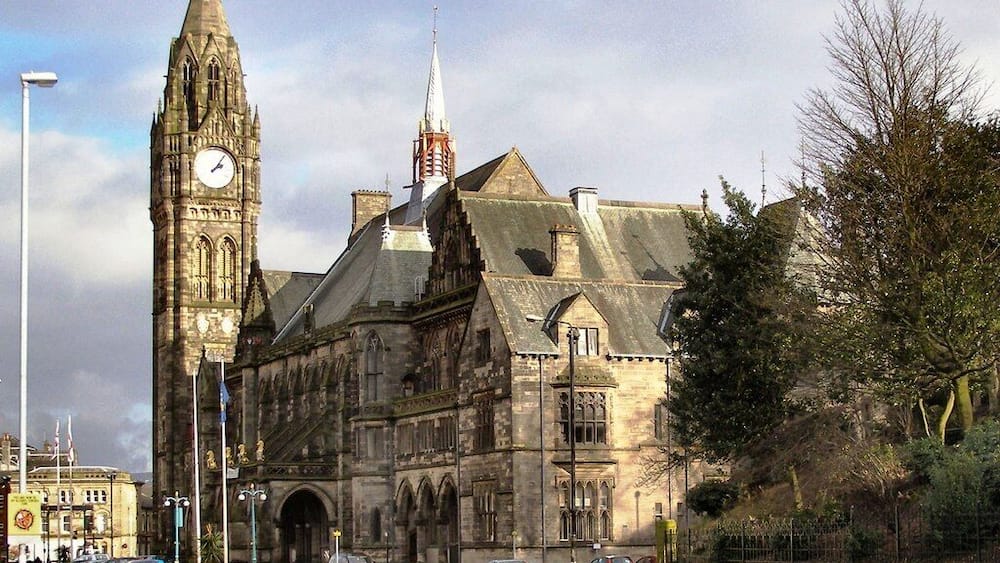 A historic building with a clock tower and a steeple.