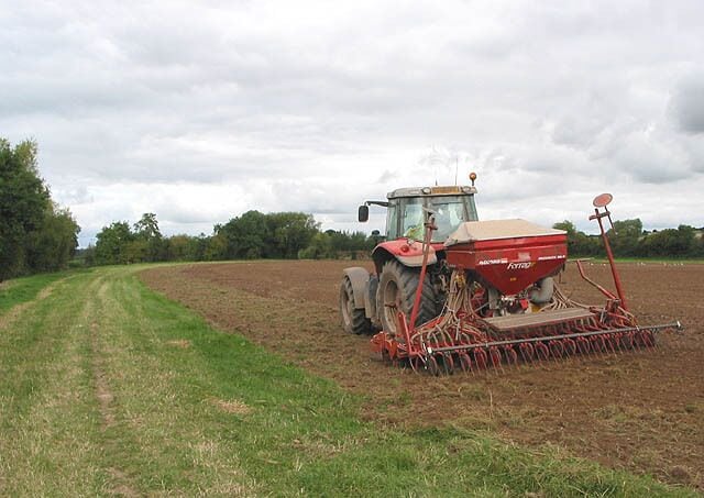 Seeding in progress near the River Wye under Greytree, near to Bridstow, Herefordshire, Great Britain.