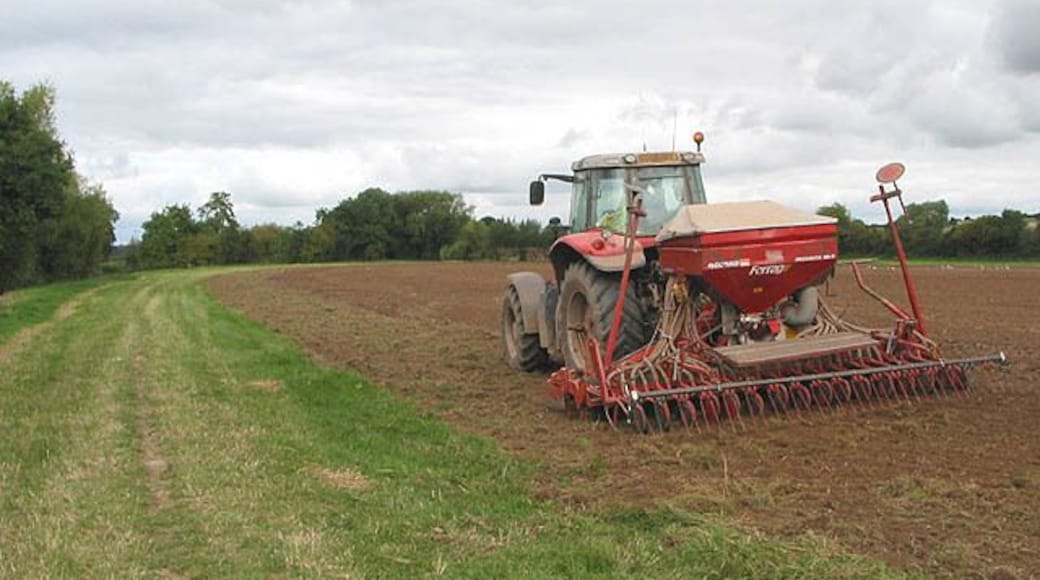 Seeding in progress near the River Wye under Greytree, near to Bridstow, Herefordshire, Great Britain.