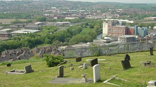 The bottom of Moorgate Cemetery From here there is a fine view out over the Rother and Don valleys. The Rank Hovis flour mill is the dominant building.