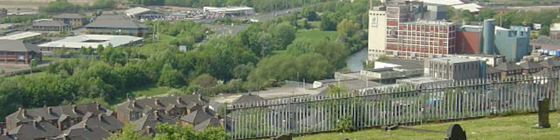 The bottom of Moorgate Cemetery From here there is a fine view out over the Rother and Don valleys. The Rank Hovis flour mill is the dominant building.