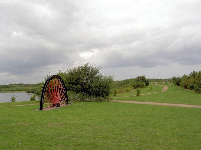 Tributes to the past. Mining head gear wheel and monuments to the past industrial nature of the Dearne Valley can be seen here at Wath.