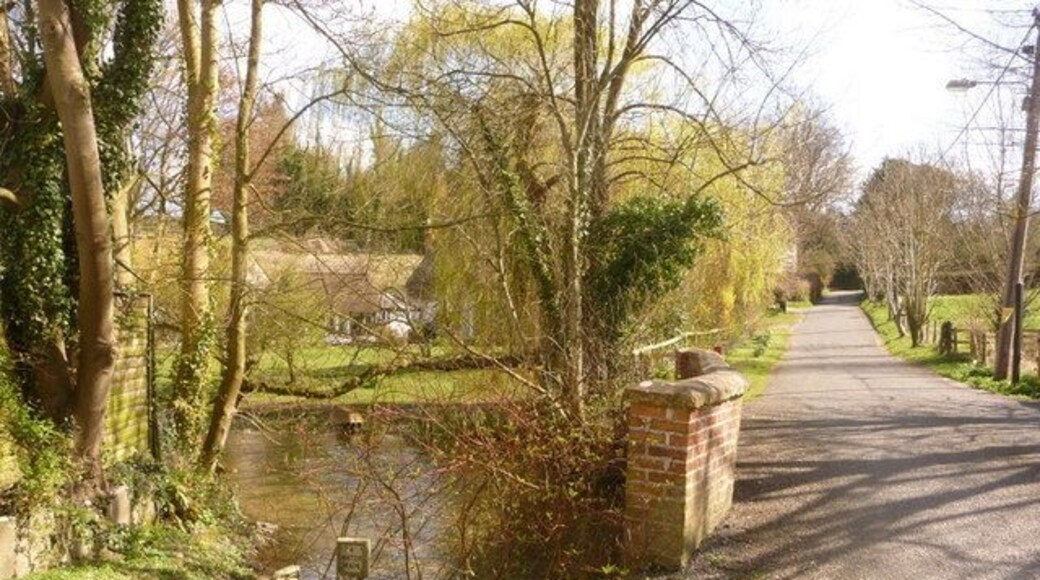 Winterbourne Stoke: Church Street crosses the Till The River Till flows through Winterbourne Stoke and alongside Riverside Cottage, whose garden buildings we peek in the background.