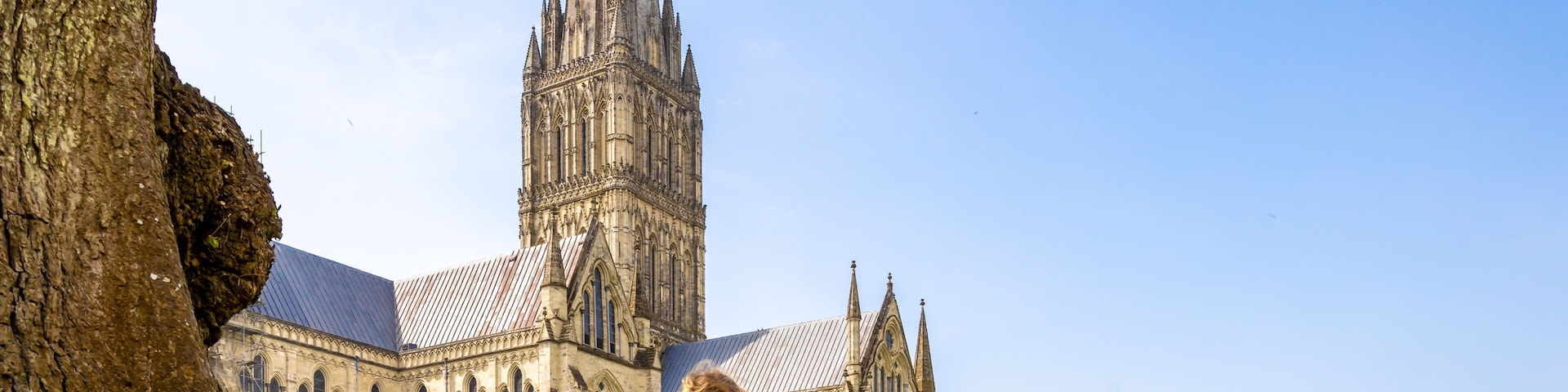 Family at Salisbury cathedral in sunny day