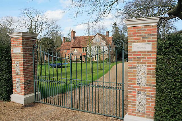 Abbotstone House, The Street, Whiteparish. Metal entry gates on brick gateposts.