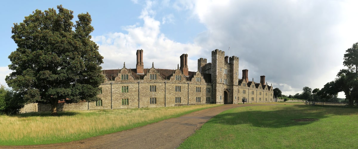 A large stone castle with multiple towers and a central entrance.