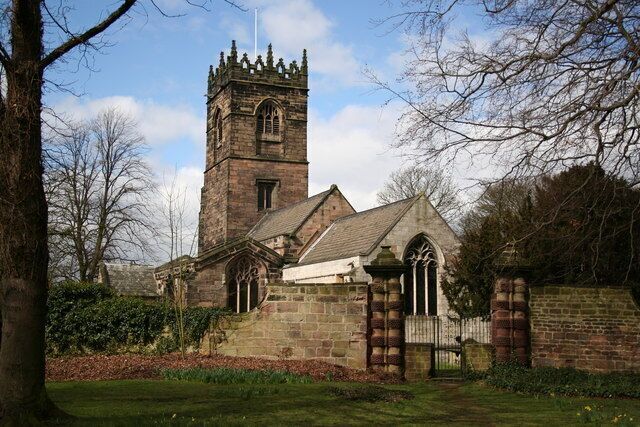 A church with a tall tower and arched windows.