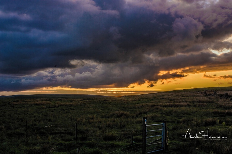 Sunset behind stormy clouds.