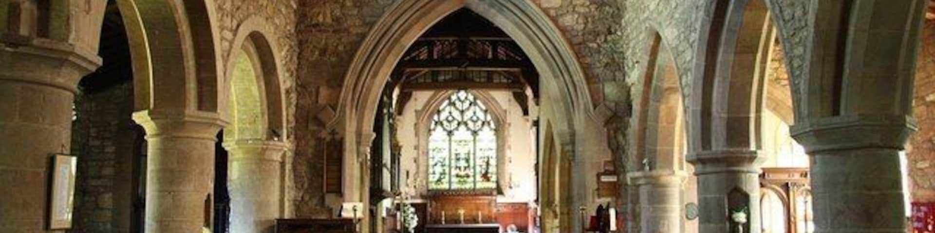 All Hallows nave Looking east towards the 19th century chancel arch with arcades of c1200, the north one still Romanesque, the Gothic south one slightly later