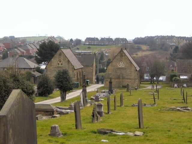 Charltonbrook Cemetery. Looking south from the heights of the cemetery, past the twin chapels at its entrance. Houses at Burncross stand on the adjacent hill.
