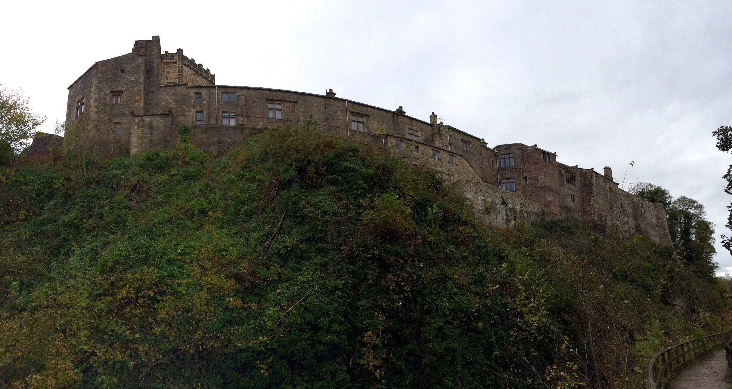 SKIPTON CASTLE in Yorkshire, England.  This iphone panorama was taken from the walk along the Skipton Canal.  
I didn't go into the castle this time; however, the entrance is on the other side of the picture, a bit to the right.  It was lovely to see the castle from this perspective because it is quite big!  
Skipton Castle is well worth visiting and full of beautiful nooks and crannies.  There is an entrance fee, but so worthwhile!  
Skipton is also a great base to explore the surrounding Yorkshire Dales #NationalPark.