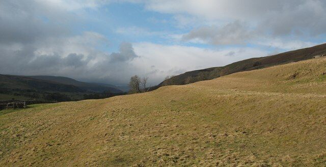 Old plough strips in Littondale. The peasant farmers of Hawkswick would have had very little land available on which to grow crops in centuries past, but down dale from the village the south west facing slopes below Knipe Scar had a gentle enough angle to allow ox drawn ploughs to be used. These plough strips [or lynchets] are most likely of medieval date and have left a distinctive 'stepped' landscape on the daleside.