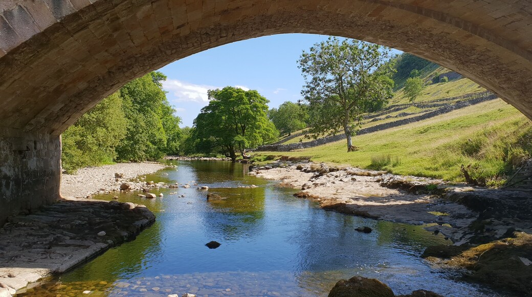 View of the River Wharfe through the 'New' Bridge at Kettlewell, Yorkshire. Looking downstream.