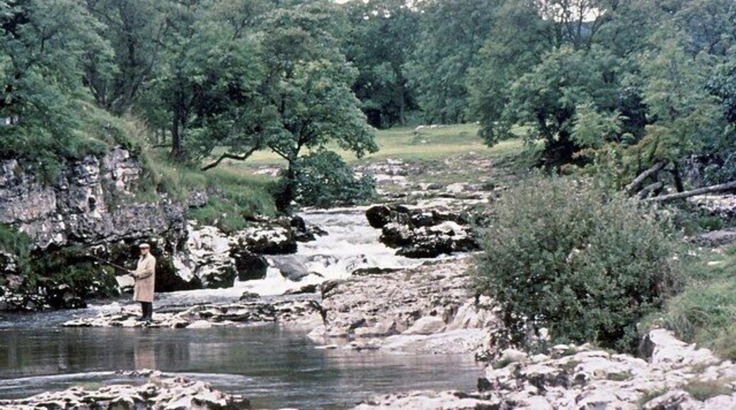 The Wharfe above Grassington. A fisherman casts his line into a deep pool not far downstream from Ghaistrill's Strid.