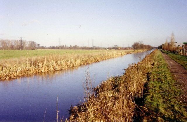 Straight canal near Slough The Slough arm of the Grand Union Canal looking east, the horizon pricked with power pylons.