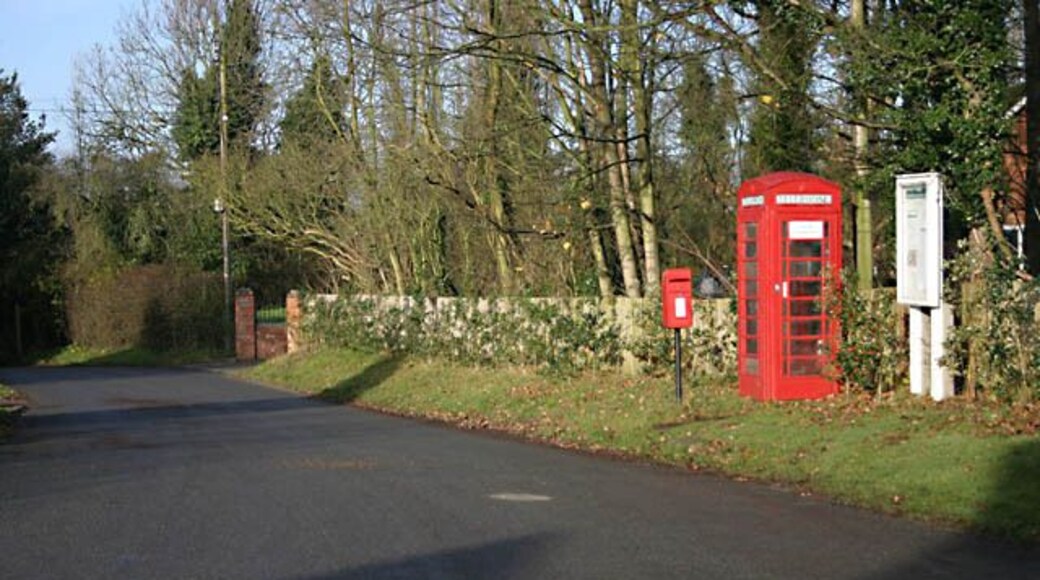 Notice board The board is to announce information from Bickenhill Parish Council. The notice on the phone box states, 'coind not accepted'.