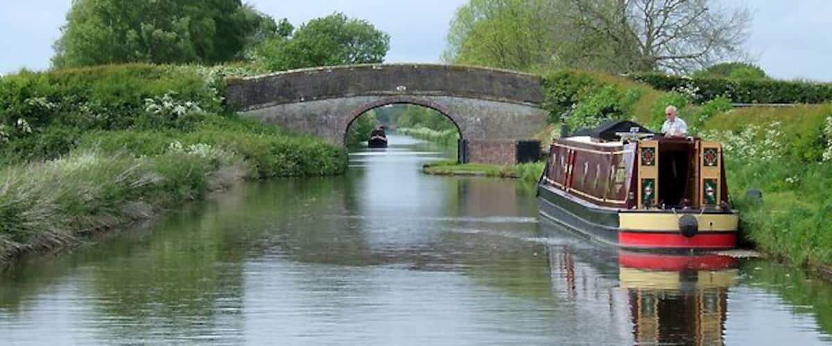 Shropshire Union Canal near Church Eaton, Staffordshire. This is approaching Little Onn Bridge, No 24, which carries a narrow lane between Church Eaton and Marston. The canal was opened in 1835. It was engineered by Thomas Telford. In order to make the route as straight (and short) as possible with the technology of his time, the canal was built on many embankments, and through many cuttings, some very deep.
