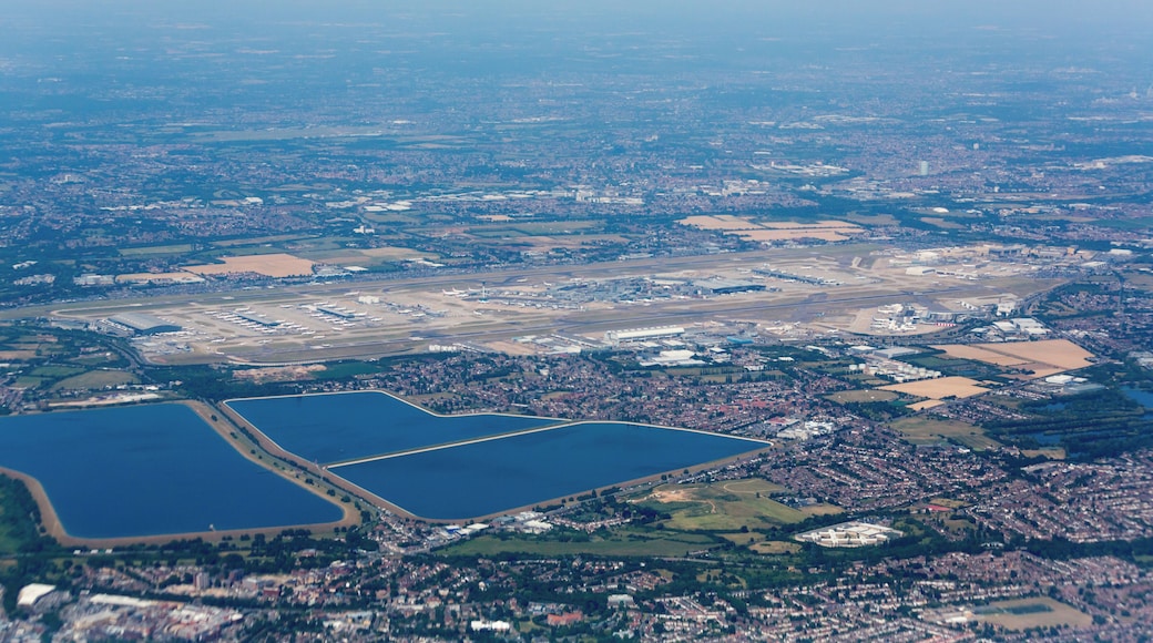 Aerial photograph of London taken on a Boeing 747-436 registration G-CIVG on departure from London Heathrow Airport (LHR/EGLL). Heathrow Airport is visible in the central foreground, with Staines Reservoirs under it, and King George VI Reservoir to its left.