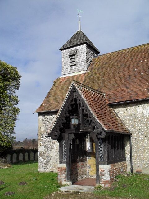 A church with a steeple and a bell tower.