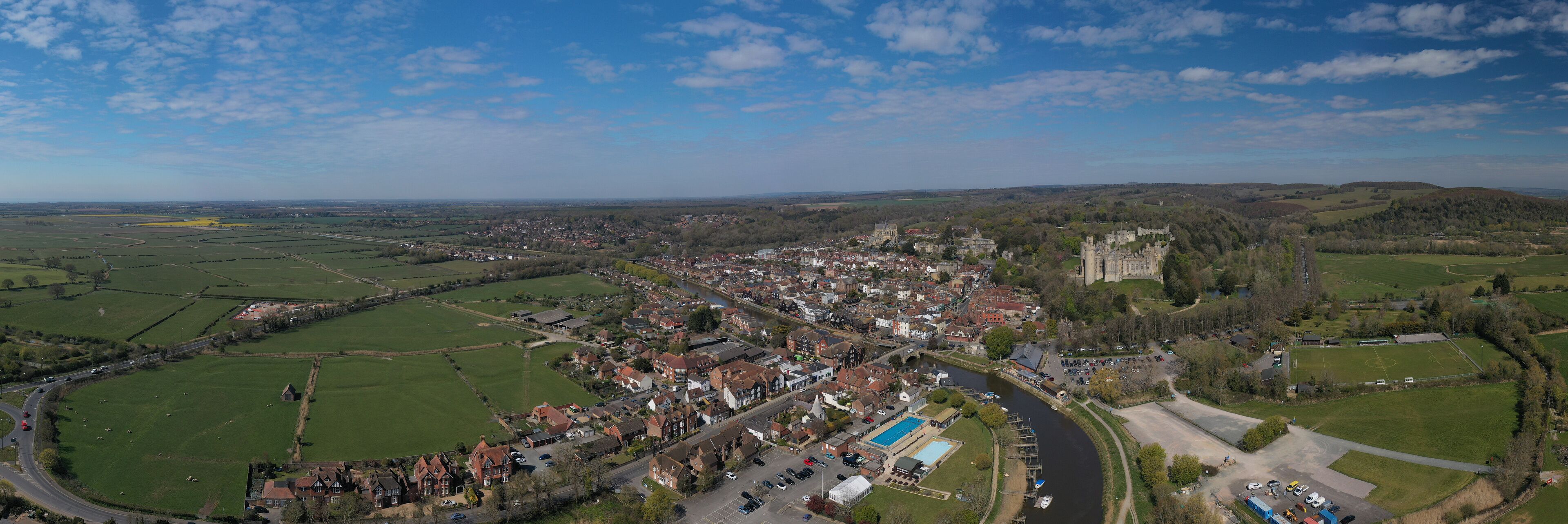Arundel West Sussex aerial panoramic view of the River Arun running past Arundel Castle and the Cathedral of this popular tourist destination in West Sussex.