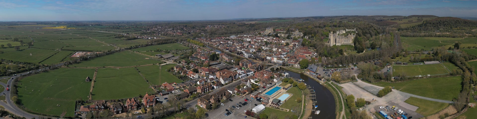 Arundel West Sussex aerial panoramic view of the River Arun running past Arundel Castle and the Cathedral of this popular tourist destination in West Sussex.