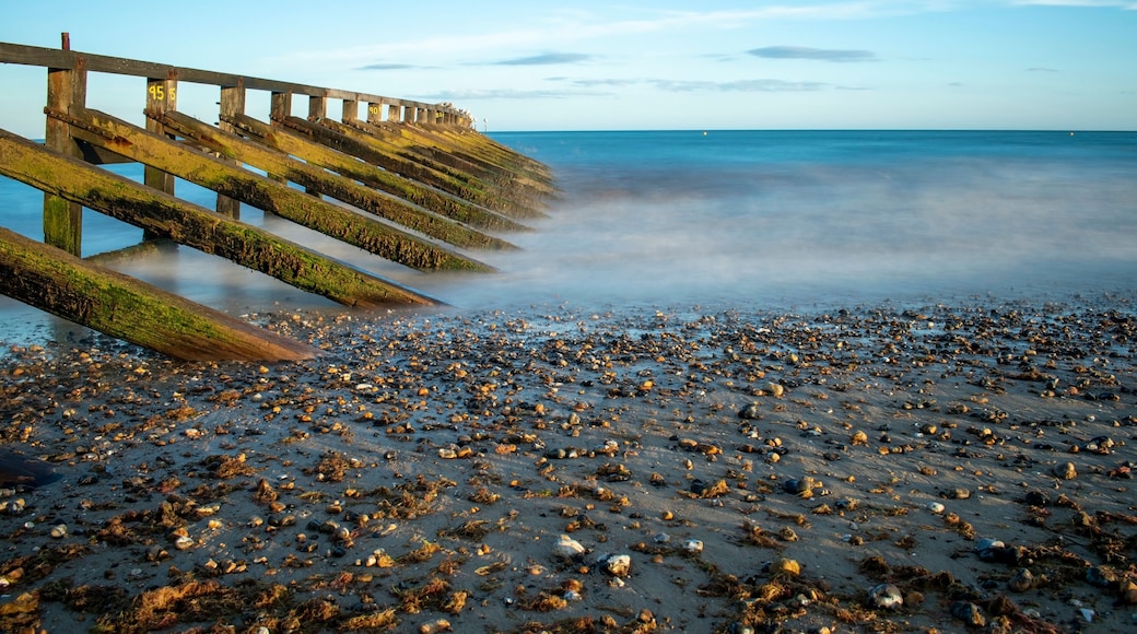 Calm and tranquil photo of the sea at west beach Littlehampton and the wooden sea defence for the River Arun.