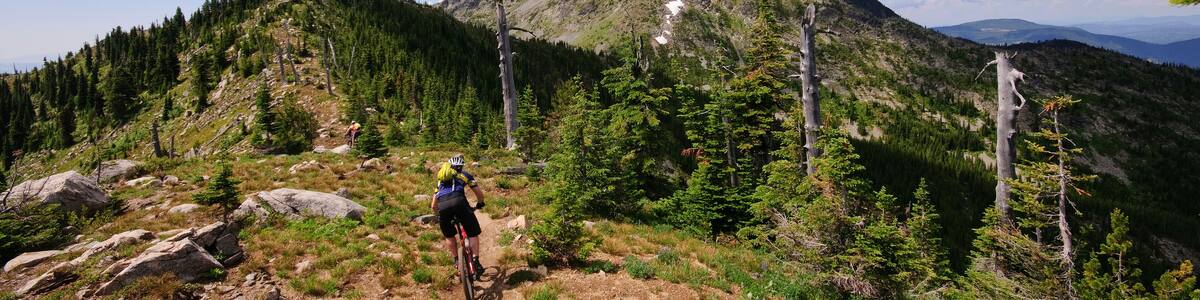 Mountain biking along the Seven Summits trail in Rossland. Kootenay Rockies region, British Columbia, Canada