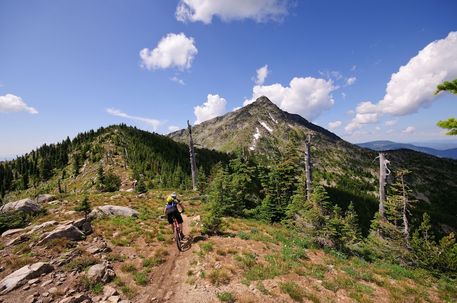 Mountain biking along the Seven Summits trail in Rossland. Kootenay Rockies region, British Columbia, Canada