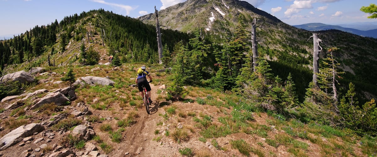 Mountain biking along the Seven Summits trail in Rossland. Kootenay Rockies region, British Columbia, Canada