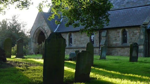 St Mary's Longnewton The churchyard and west porch.