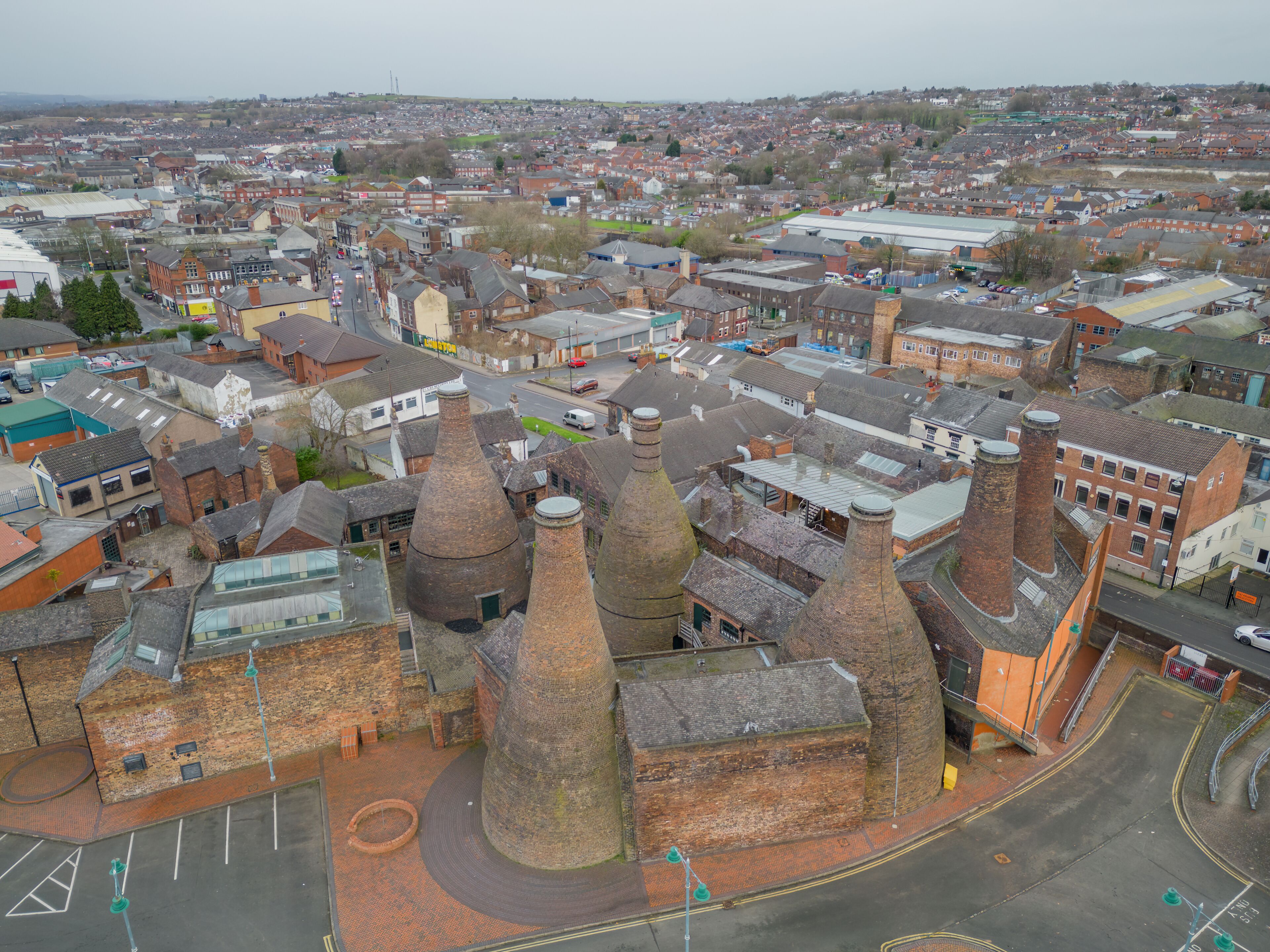 A historic town with distinctive conical buildings and a central roundabout.