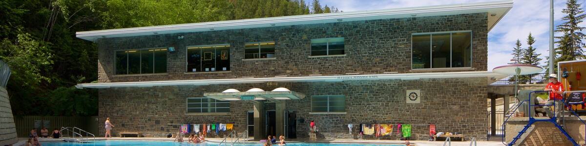 Kootenay National Park featuring a pool and swimming as well as a small group of people