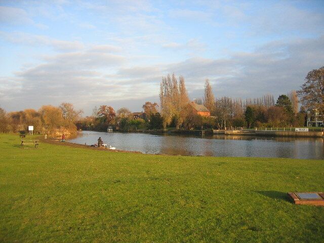 The Old Bathing Place, River Avon. According to a nearby sign this widening of the River Avon has long been an aquatic playground for natives (of Stratford-upon-Avon) and visitors alike. In the mid 1930s diving boards, a chute, changing huts and a floating safety boom were installed. Bathing suits were offer for hire (wholesale gentlemen's £1:6:0d (£1.30) per dozen and ladies' £1:12:6d (£1.625)). Those facilities survived the war but in the 1950s whispers of polio brought about their demise.