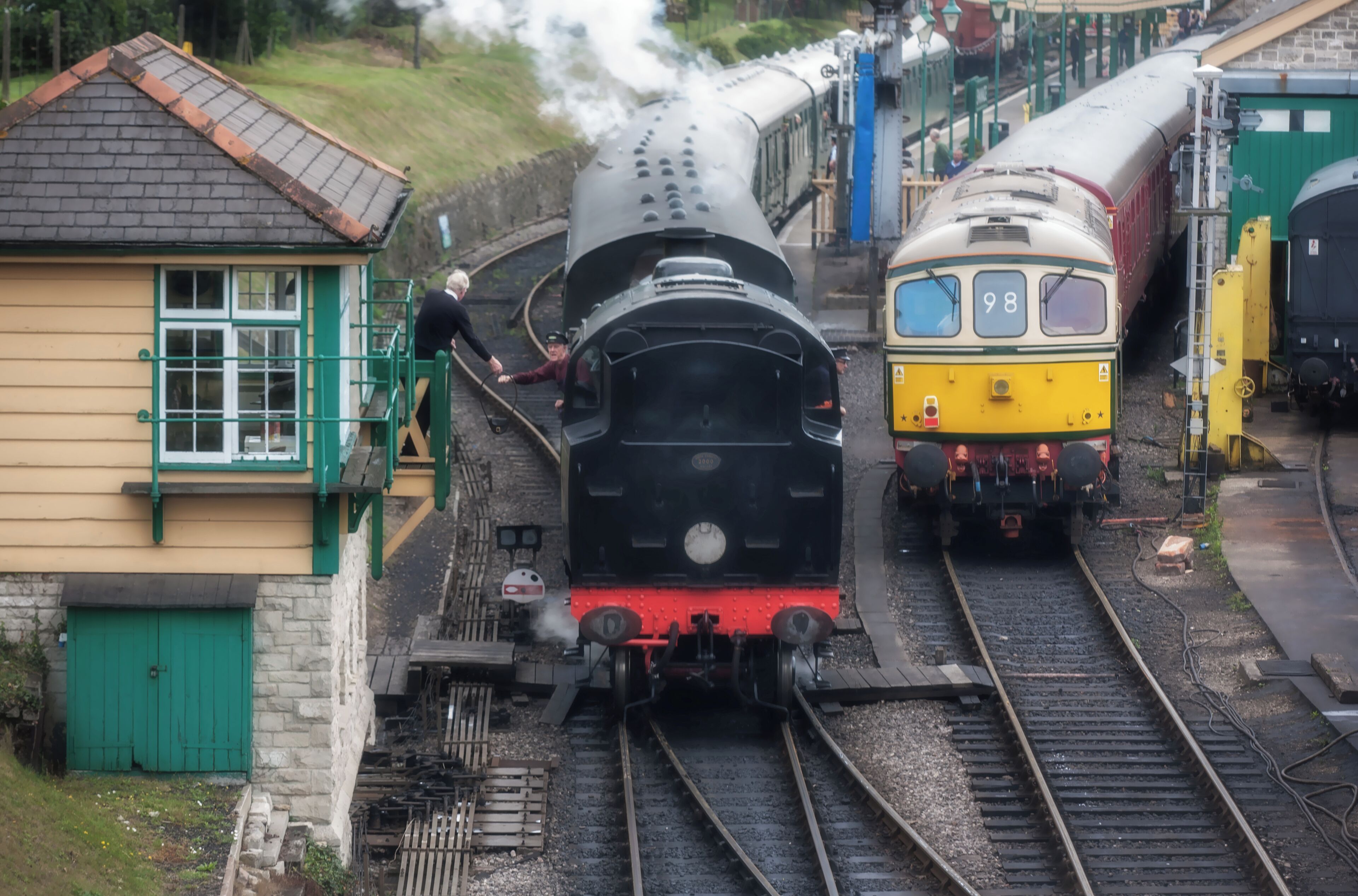 Handing over the token at Swanage railway station.
The token is a physical object, that the driver must be in posession of, to gain access to a section of track,between two points. This is a safety measure,dating back to the birth of the railways,to avoid collisions on a single line.

#Culture