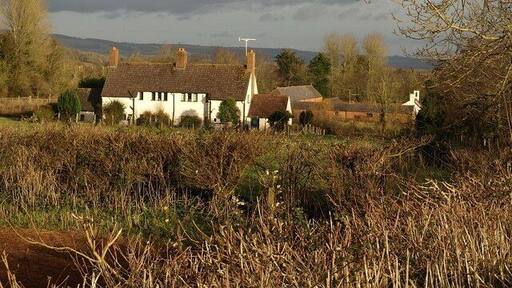 Knight's Cottages, Fitzhead Farm cottages on the western fringe of the village, seen from footpath WG 5/1. Behind to the right is Knight's Farm.
