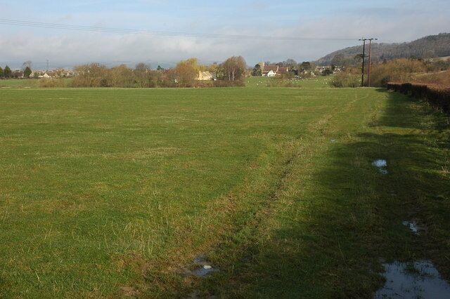 Alderton Church viewed from the south Alderton church viewed across fields from the B4077 to the south. A footpath follows to the left of the hedgerow.
