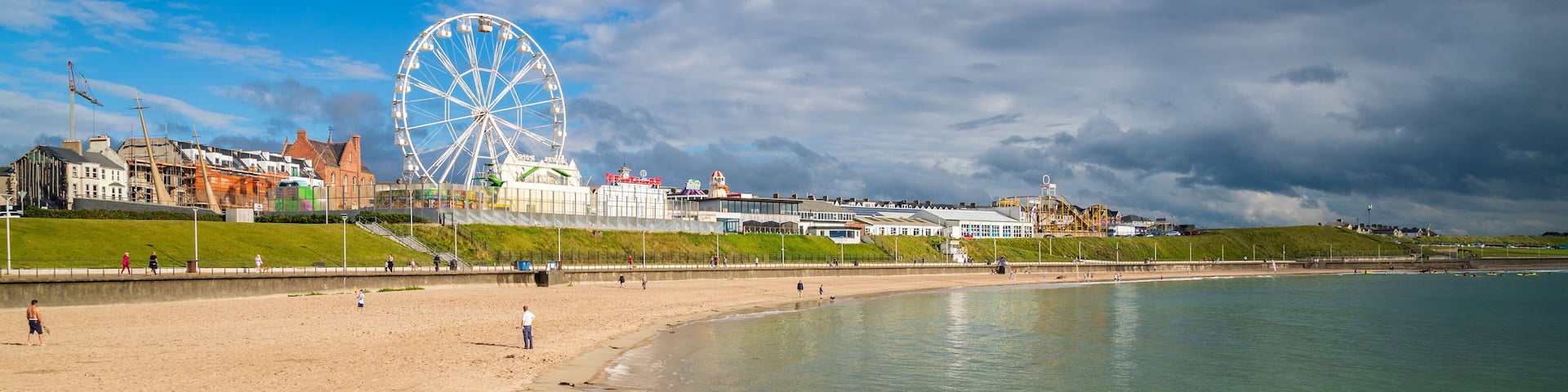 Portrush which includes a sandy beach and general coastal views