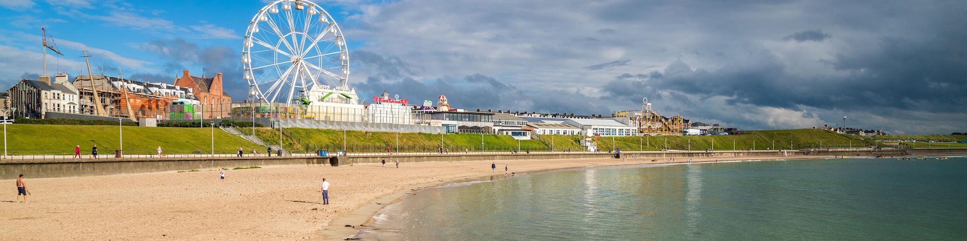 Portrush which includes a sandy beach and general coastal views
