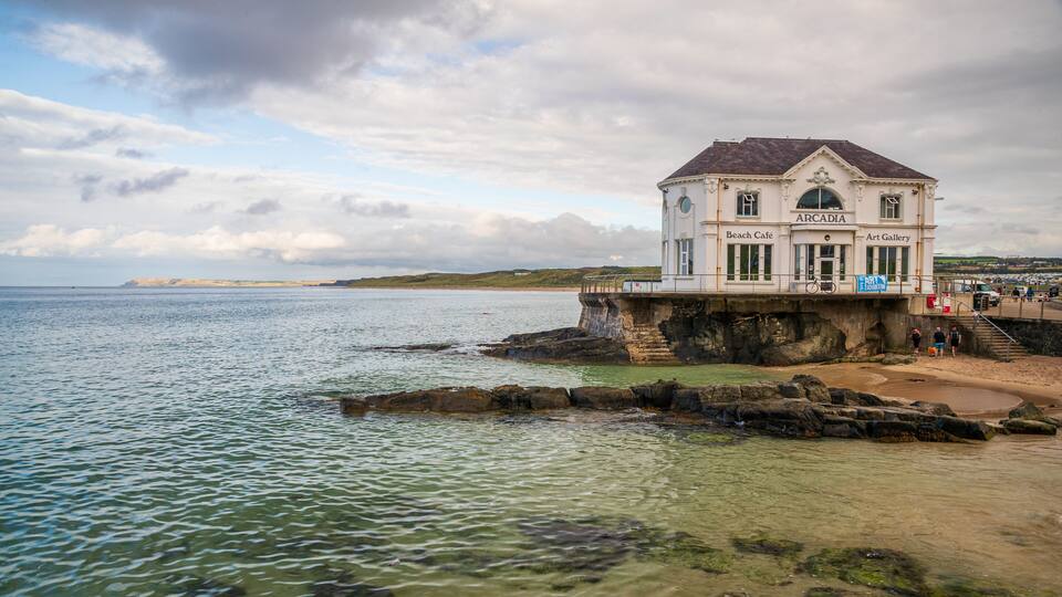 A coastal building with a beach cafe and art gallery.