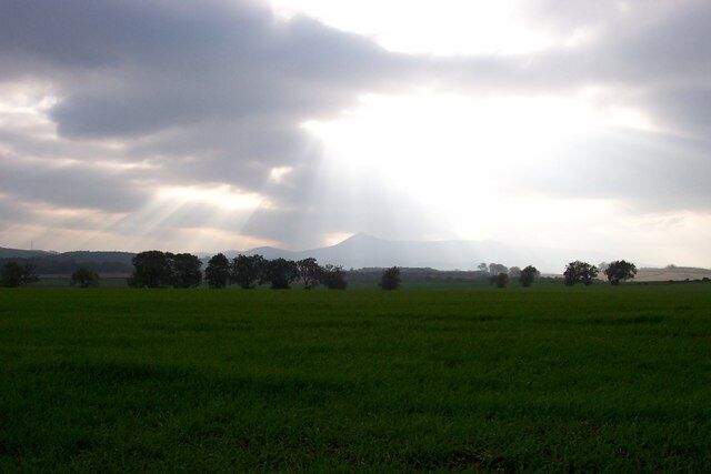 Bennachie Mount Bennachie Mount in the far distance over the fields. There has been a lot of Roman activity here in the past.