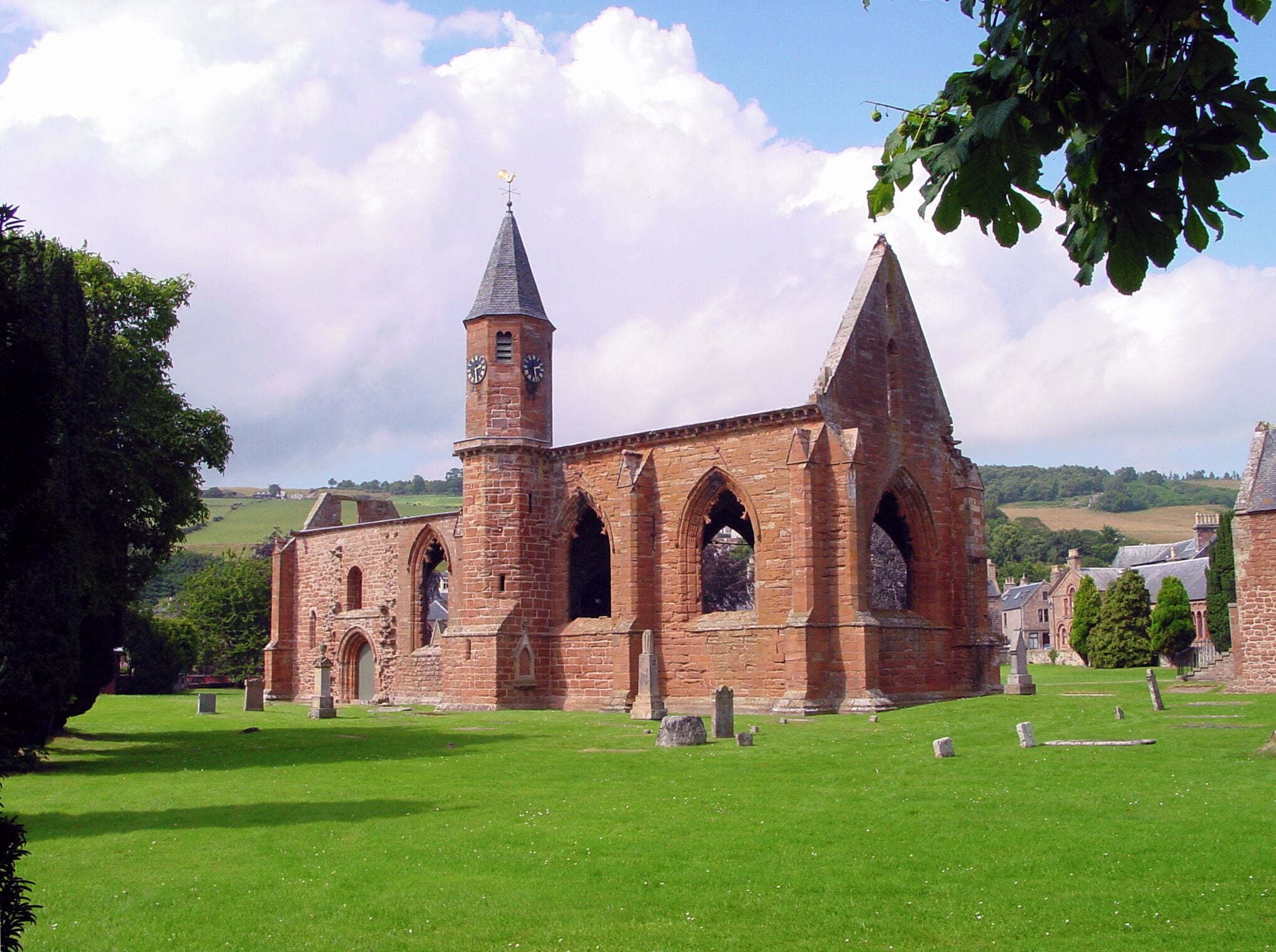 A historic church with a tall tower and arched windows.