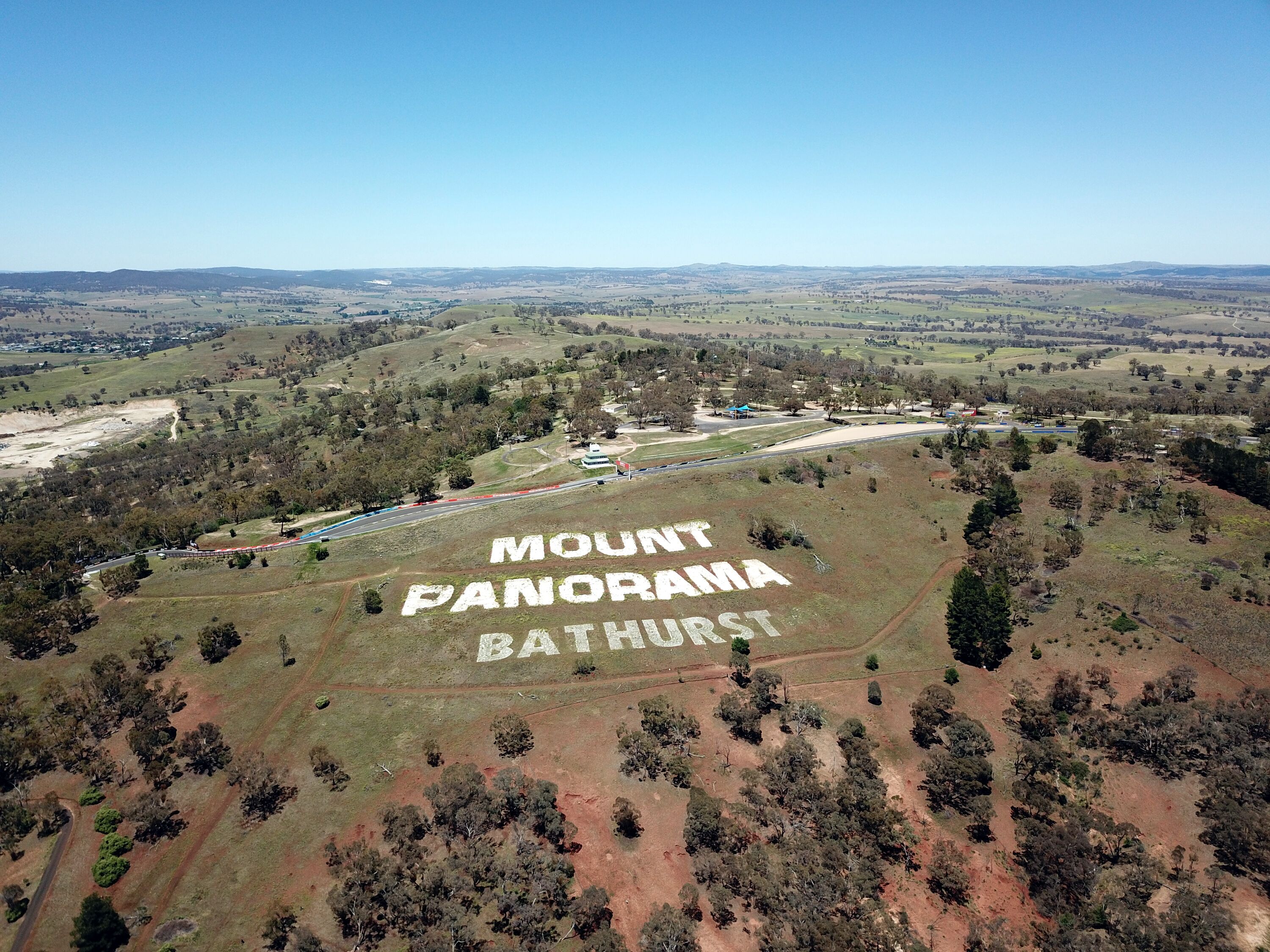 A landscape with 'MOUNT PANORAMA BATHURST' written on the ground.